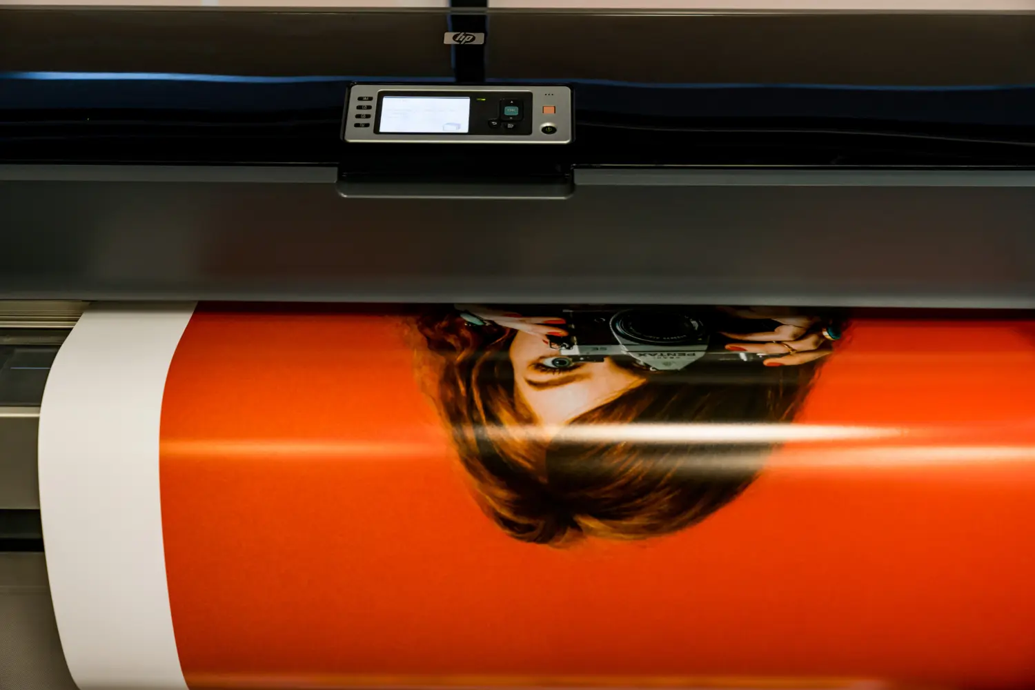 Wide format printer producing a large colour print at Rieger’s Print